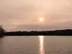 A view from Twin Bay Resort looking out over Lake Nokomis showing the sub setting.