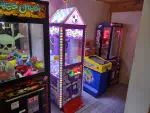 Some of the Arcade games in the Twin Bay Resort restaurant, showing a Claw machine, and candry crane game.